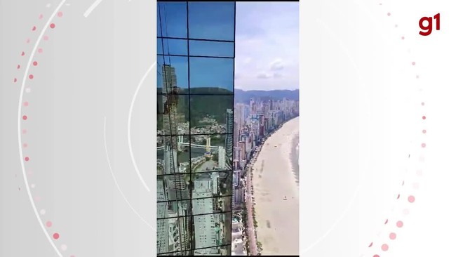 Alpinista mostra vista do prdio mais alto do Brasil durante limpeza de fachada