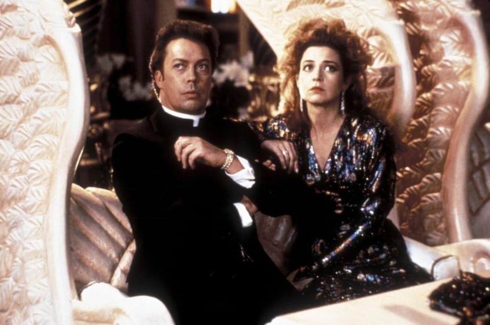 Tim Curry com Annie Potts em "Pass the Ammo" — Foto: Divulgação