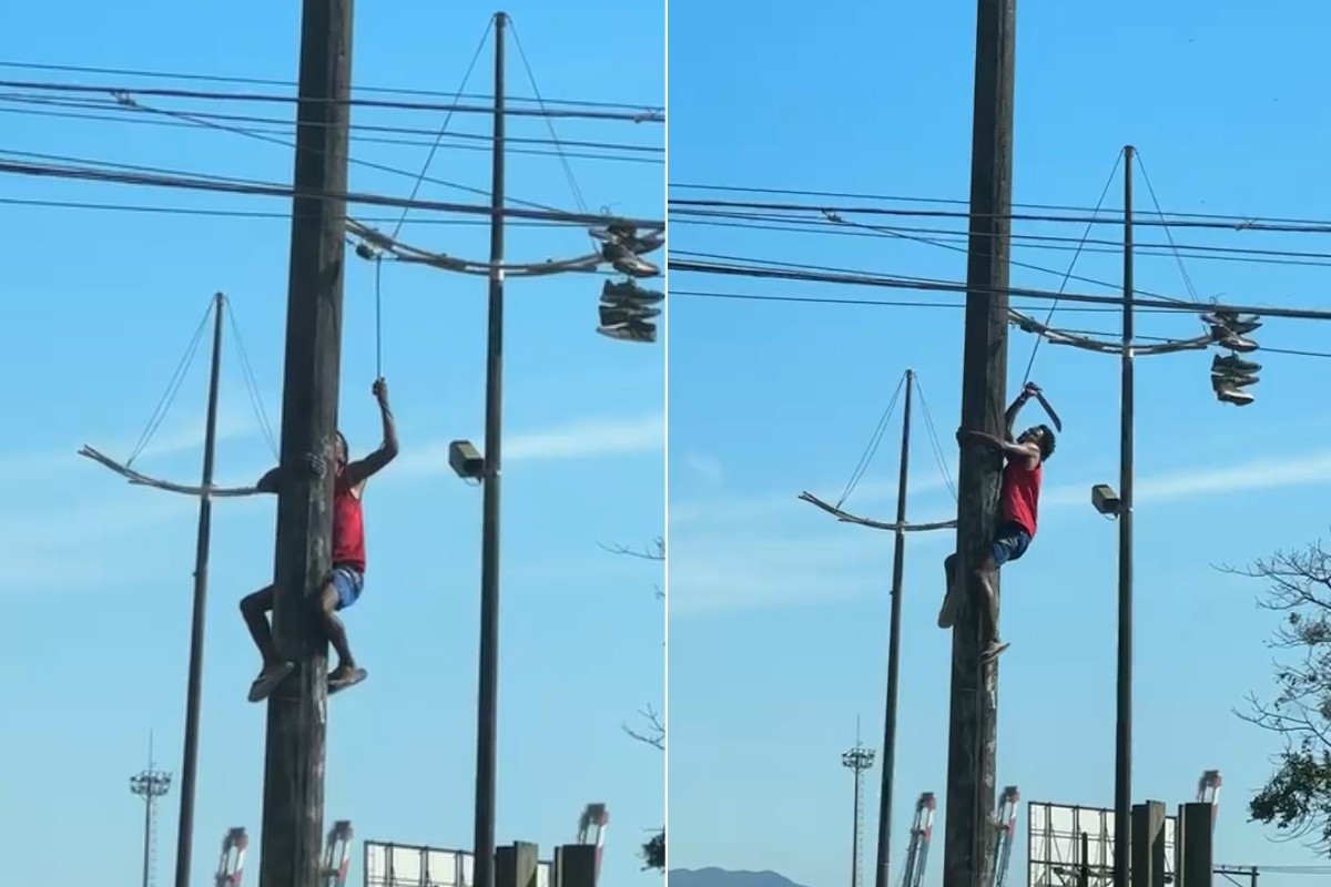 Homem escala poste e usa facão para cortar fios em Santos; VÍDEO
