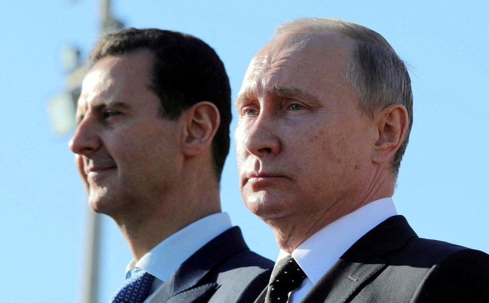 Assad e o presidente russo, Vladimir Putin, em foto de 2017 — Foto: Mikhail Klimentyev/Sputnik via Reuters