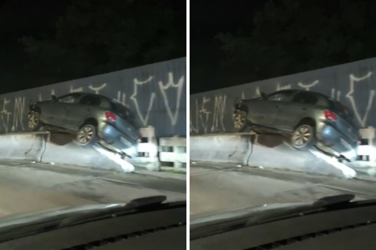 Carro sobe em mureta de ponte após acidente e interdita trecho da Rio-Santos em Caraguatatuba