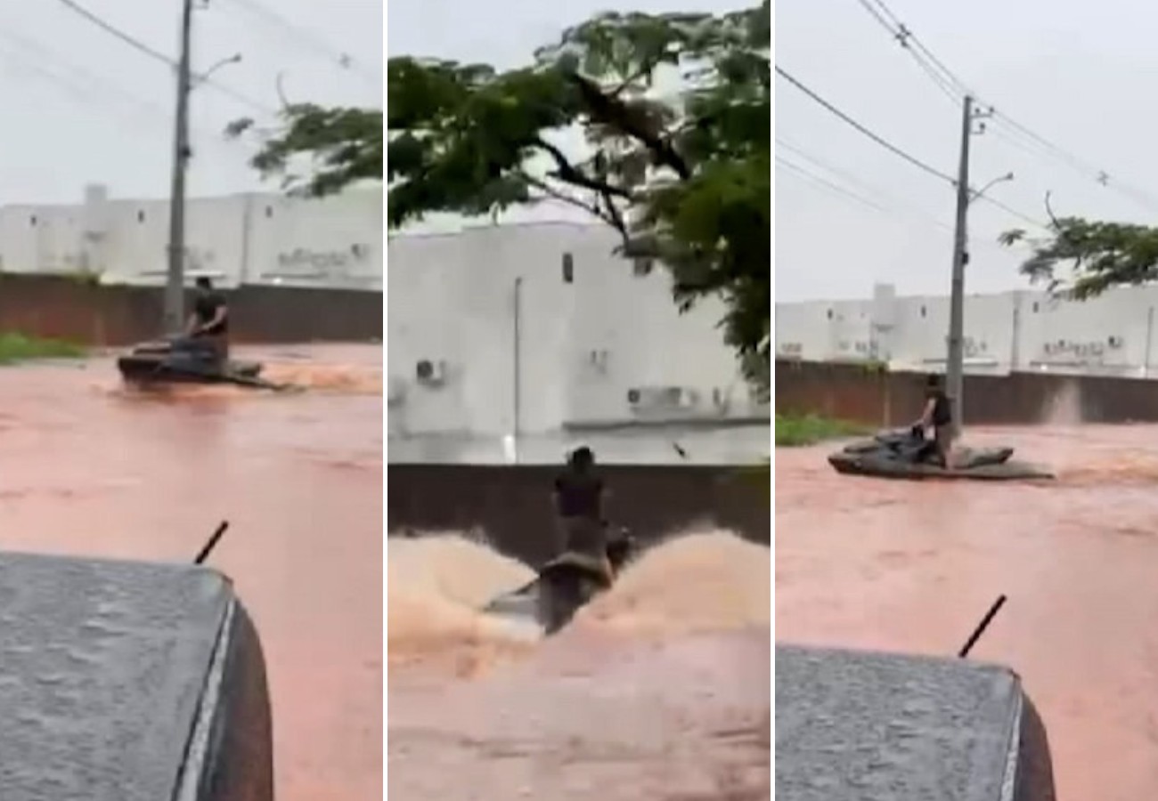Morador usa moto aquática em rua após chuva causar alagamentos em Araguaína; vídeo