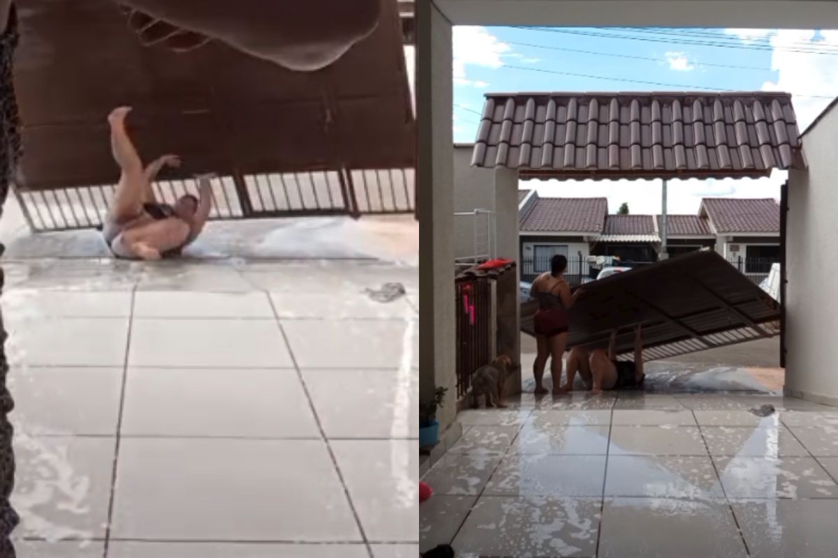 VÍDEO: casal transforma garagem em 'escorregador' para se refrescar e derruba portão durante a brincadeira, no PR