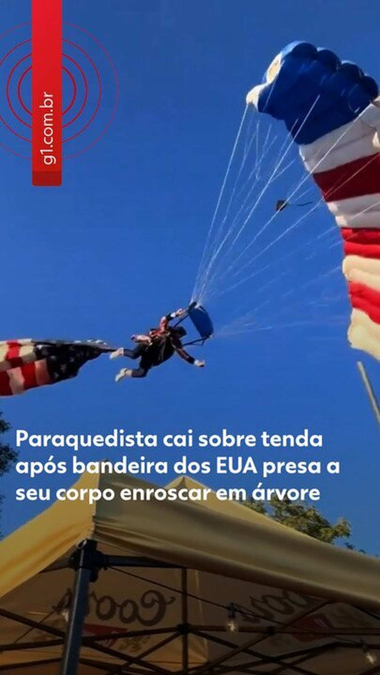 VÍDEO: Paraquedista amarrado a bandeira gigante dos EUA se enrosca em árvore e cai sobre tenda