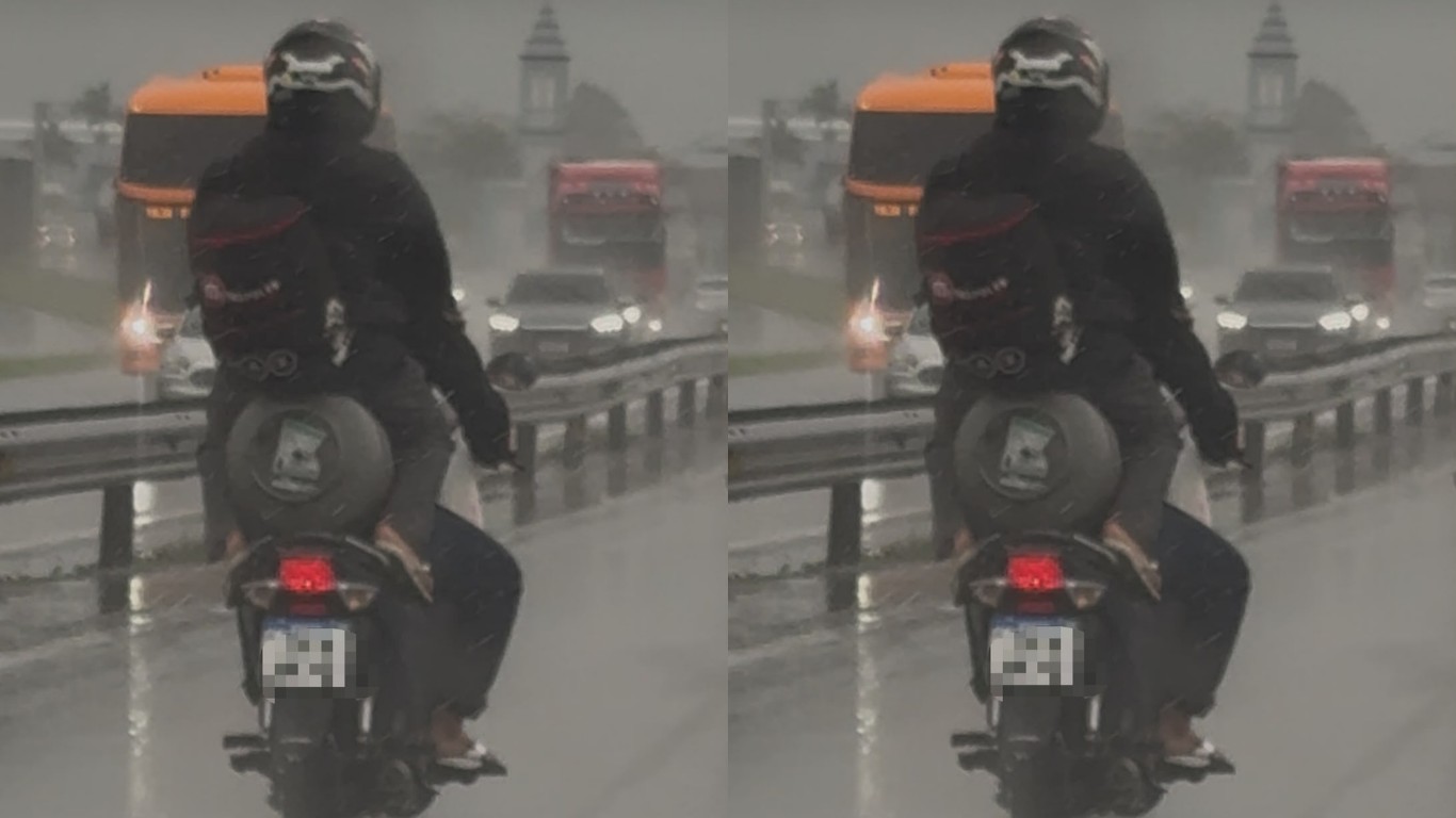 VÍDEO: Passageira é flagrada sentada em botijão de gás na garupa de moto na BR-101 em SC 