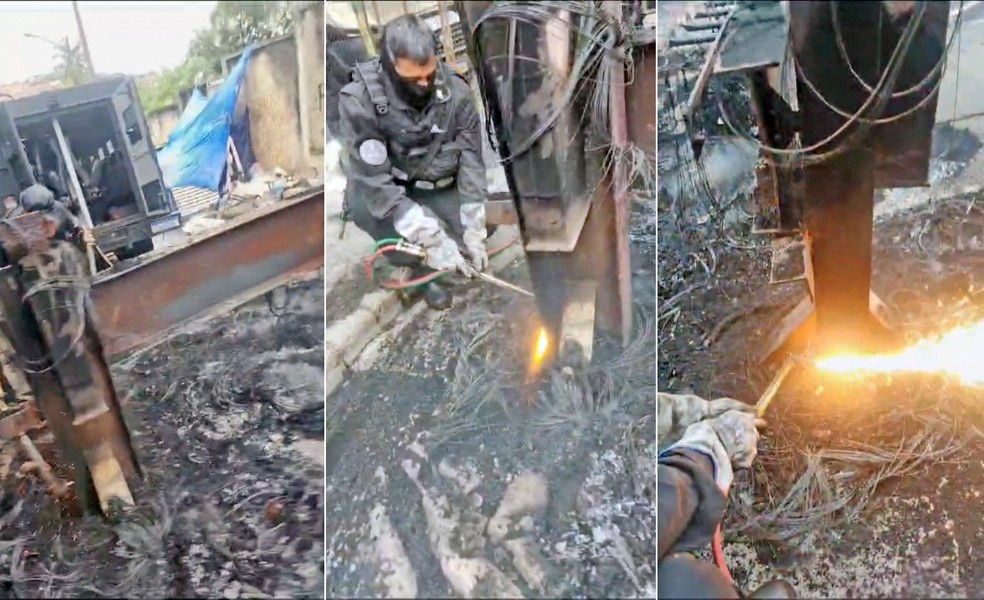 PM usa maçarico para romper barricada de trilho — Foto: Reprodução/TV Globo