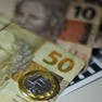 Foto: (Dinheiro, real, moeda de R$ 1, notas de R$ 10 e R$ 50 / Marcello Casal Jr/Agência Brasil)