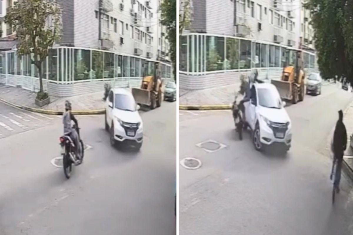 Motociclista é arremessado após bater em carro em cruzamento, fica ferido e é furtado; VÍDEO