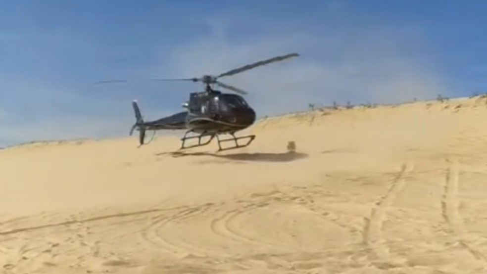 Empresário pousa helicóptero em praia no Ceará, compra piaba e vídeo viraliza — Foto: Reprodução