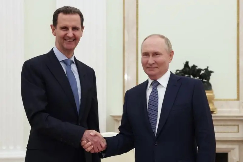 Assad e Putin se encontraram em julho de 2014 na Rússia. — Foto: EPA via BBC