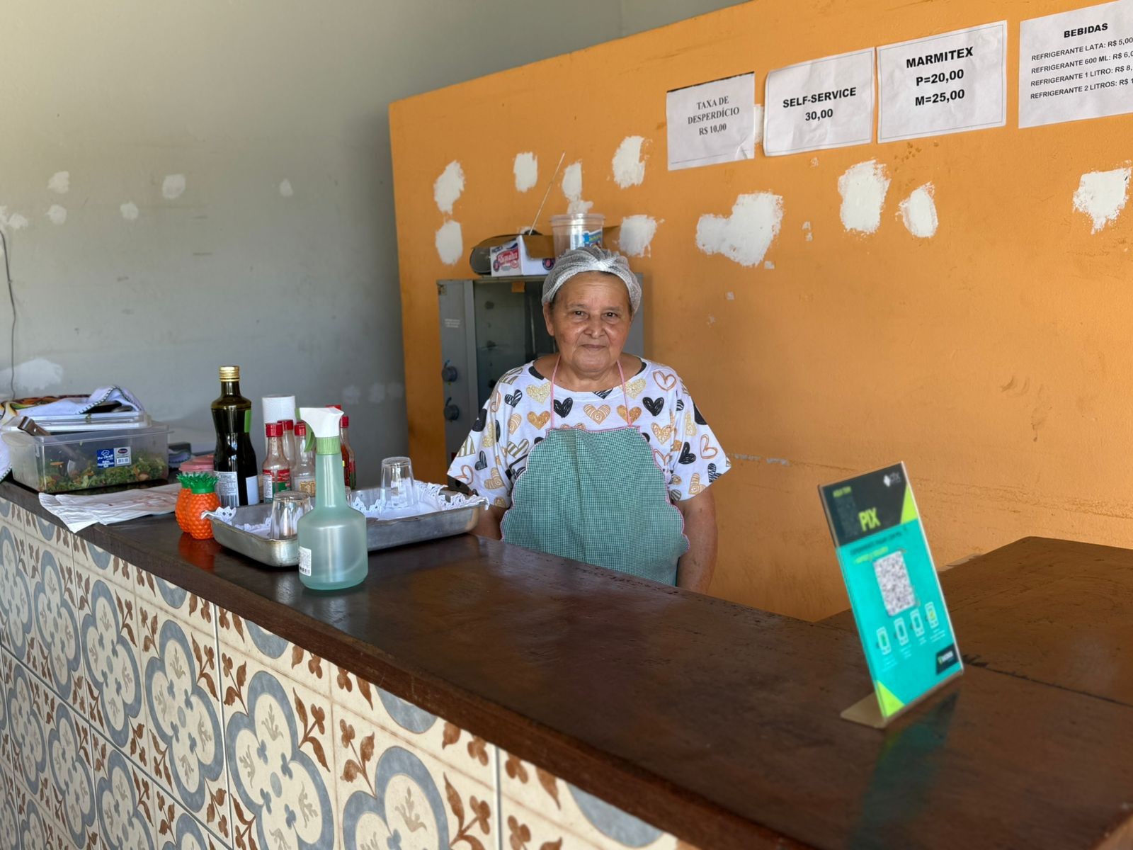 Maria Avelina, dona do restaurante em Serra da Saudade - (04-09-2025) — Foto: Anna Lúcia Silva/g1