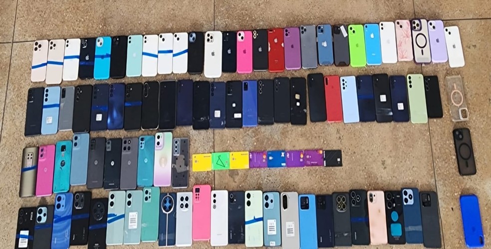 Três pessoas foram presas com 87 celulares furtados após um show do DJ Alok — Foto: Ascom/PC