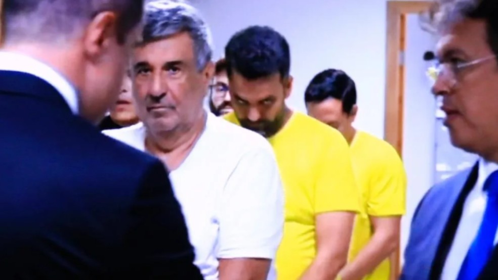 Wilson Pollara, Bruno Vianna e Quesede Henrique em audincia de custdia, em Goinia, Gois  Foto: Reproduo/TV Anhanguera