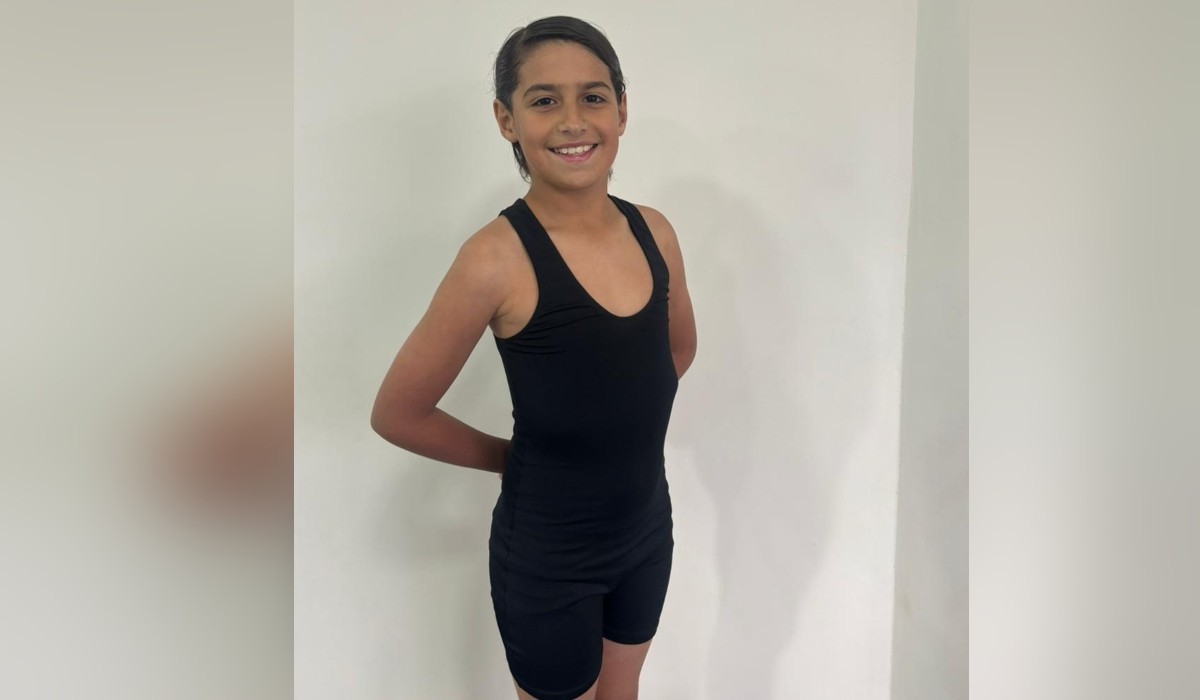 Pai passa mais de 8 horas por dia vendendo bala no sinal para custear viagem do filho à seletiva do Bolshoi