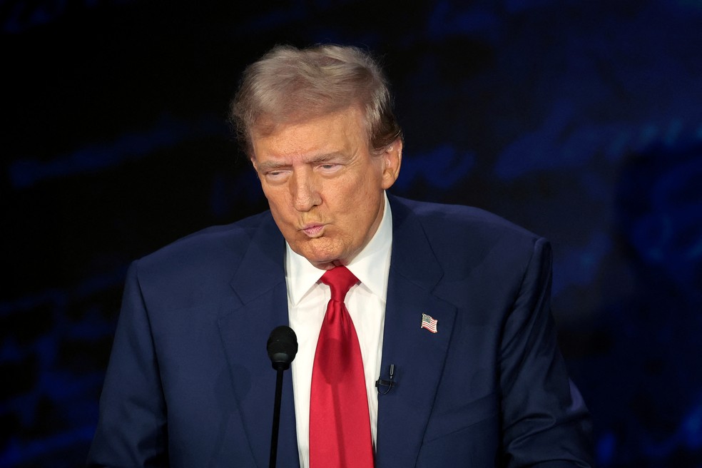 Donald Trump faz careta ao reagir à fala de Kamala Harris — Foto: Win Mcnamee/Getty Images via AFP