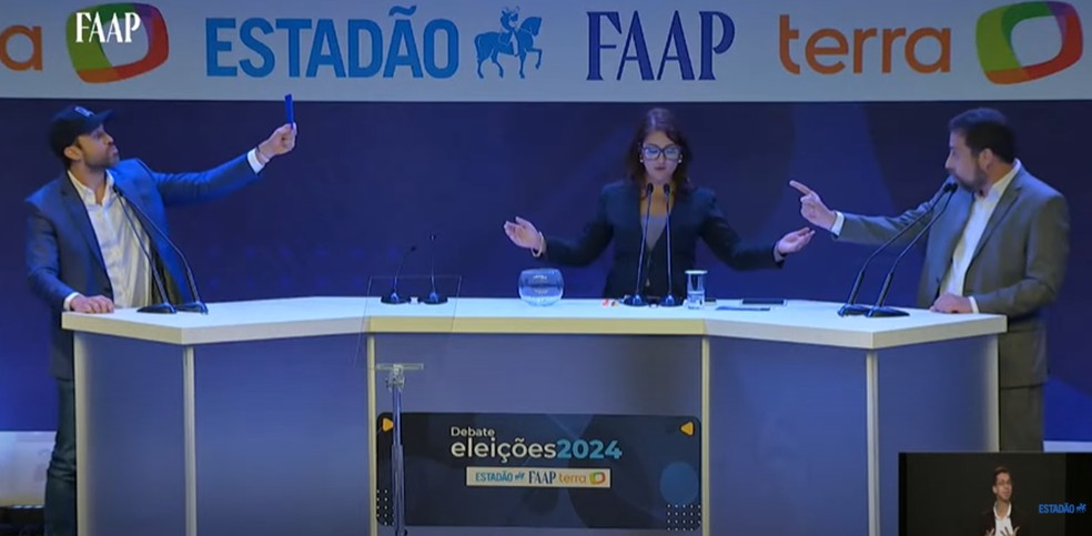 Candidatos trocam ofensas durante debate. — Foto: Reprodução/ Youtube