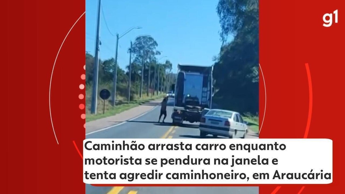 Caminhão arrasta carro enquanto motorista tenta agredir caminhoneiro