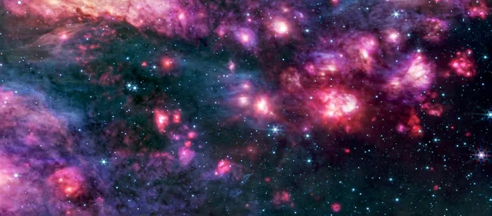 Esta é uma imagem no infravermelho médio de Sagitário B2 capturada pelo Telescópio Espacial James Webb. Sagitário B2 é uma região do espaço rica em moléculas e um dos locais onde os cientistas pensavam ter observado glicina antes que essa afirmação fosse refutada. — Foto: o rica em moléculas e um dos locais onde os cientistas pensavam ter observado glicina antes que essa afirmação fosse refutada. NASA, ESA, CSA, STScI, A. Ginsburg (Universidade da Flórida), N. Budaiev (Universidade da Flórida), T. Yoo (Universidade da Flórida).  Processamento de imagem: A. Pagan (STScI)