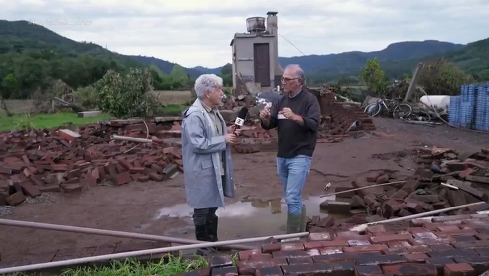 Produtor rural Roque Zilio conta que conseguiu se agarrar em uma rvore — Foto: Reproduo/TV Globo