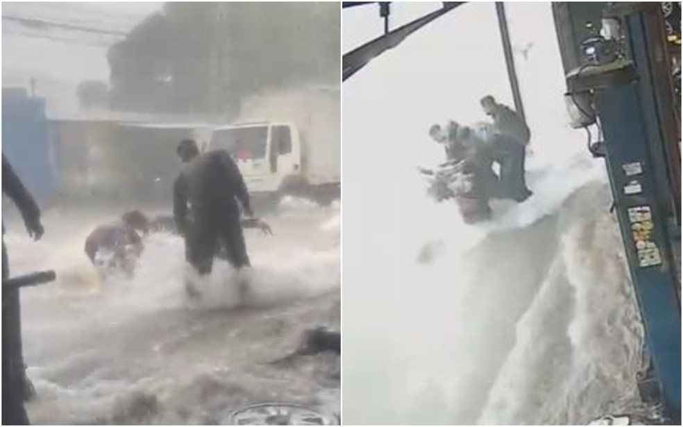 Homens resgatam motociclista de enxurrada em Goiânia — Foto: Reprodução/TV Anhanguera 